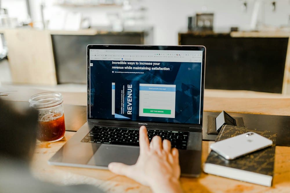 Laptop showing revenue growth for coaching payments