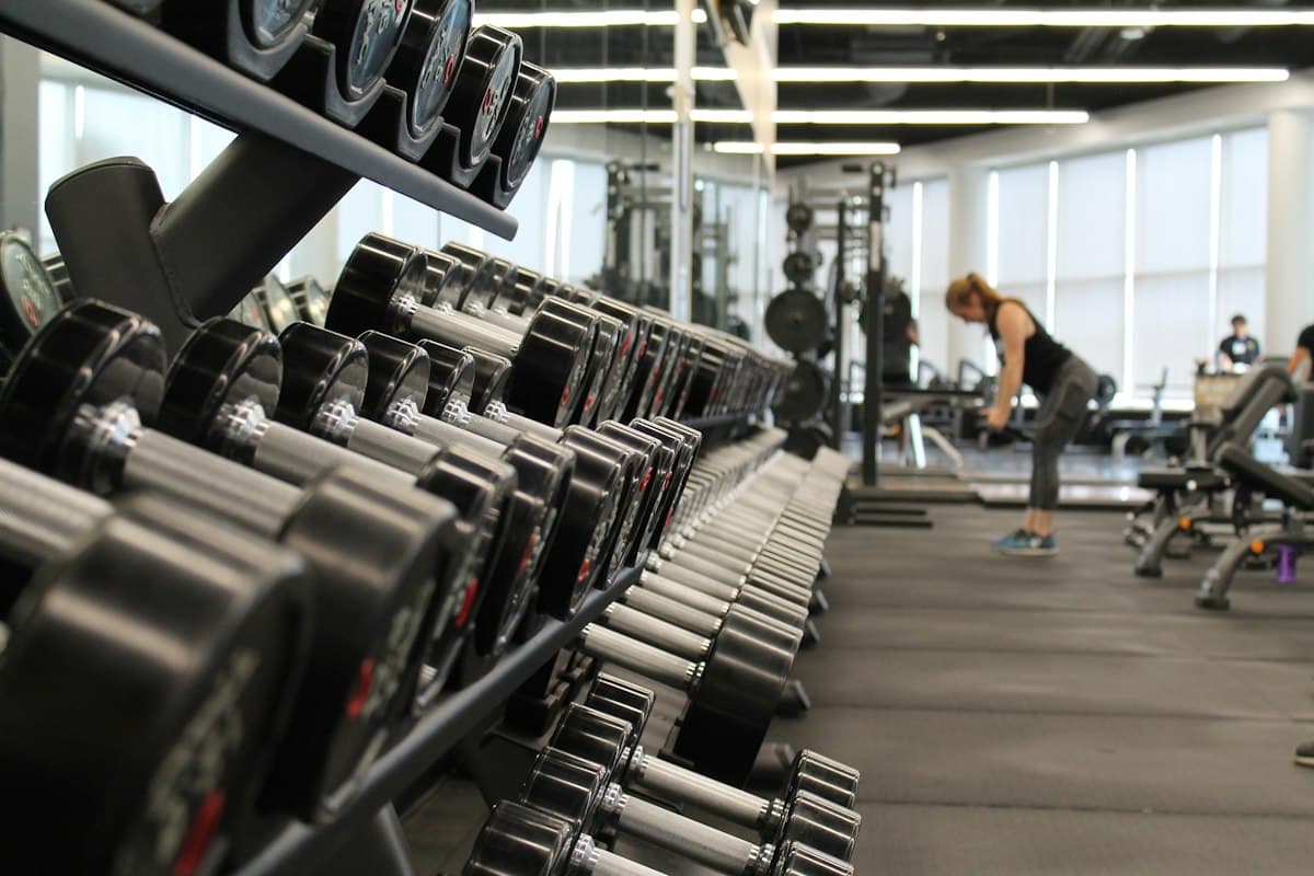 Dumbbell rack in a bright gym for workout programming